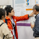 Talking by a poster